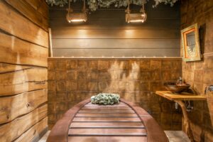 Modern luxury spa room with ambient lighting and comfortable seating representing high-end wellness spaces