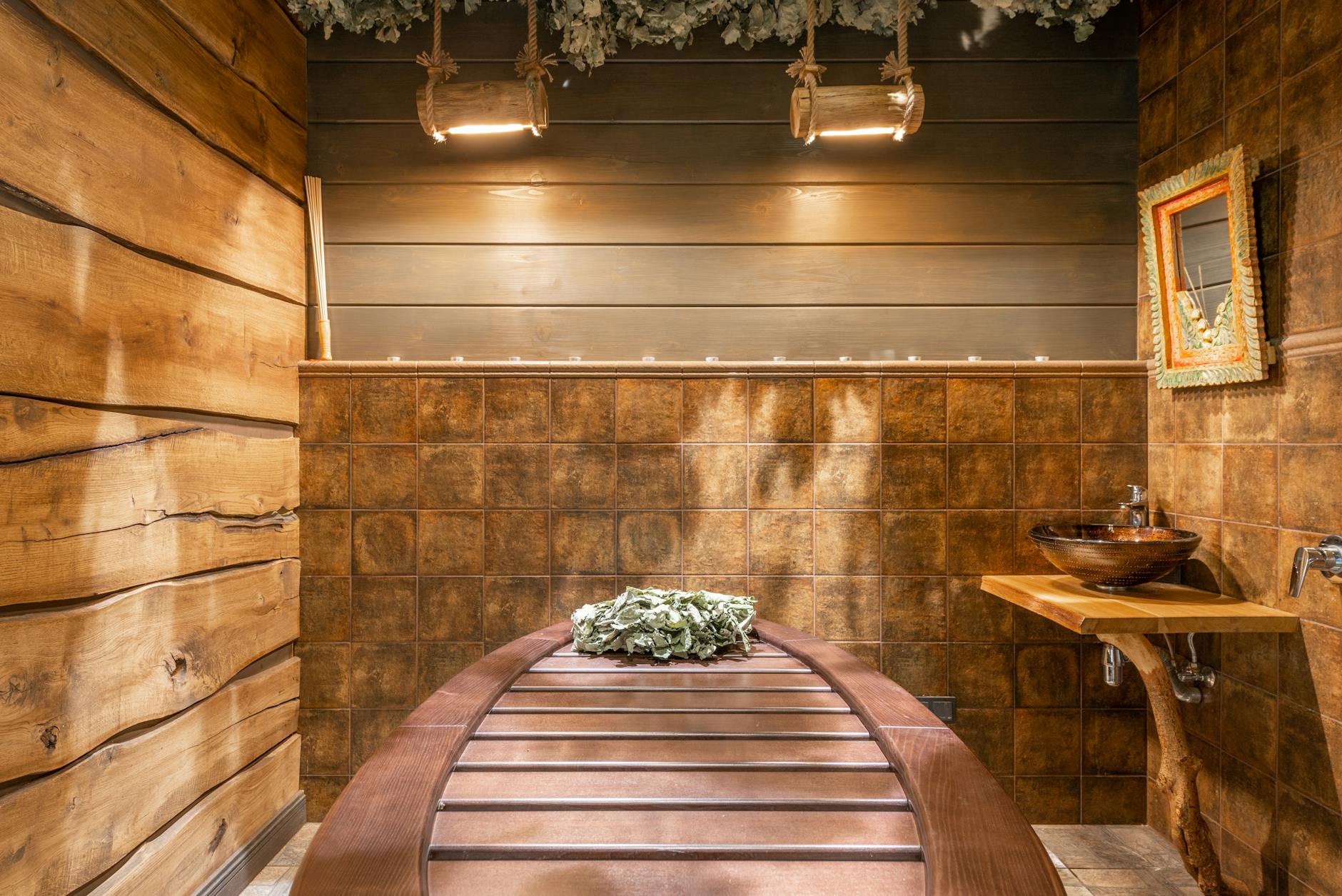 Modern luxury spa room with ambient lighting and comfortable seating representing high-end wellness spaces