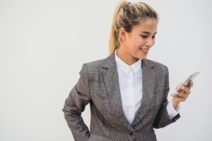 Professional businesswoman in modern office setting wearing executive attire