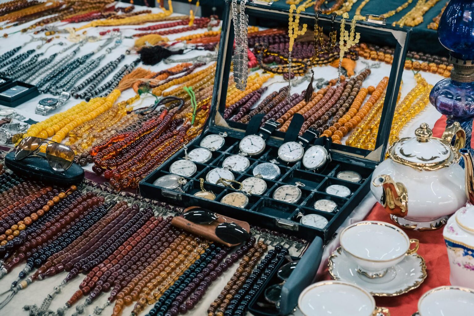 Collection of vintage black jewelry pieces displayed on a light surface
