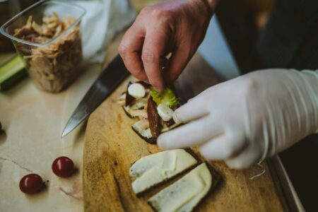 Professional meal preparation setup with organized ingredients and planning materials