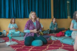 Serene meditation studio with soft lighting and minimalist decor