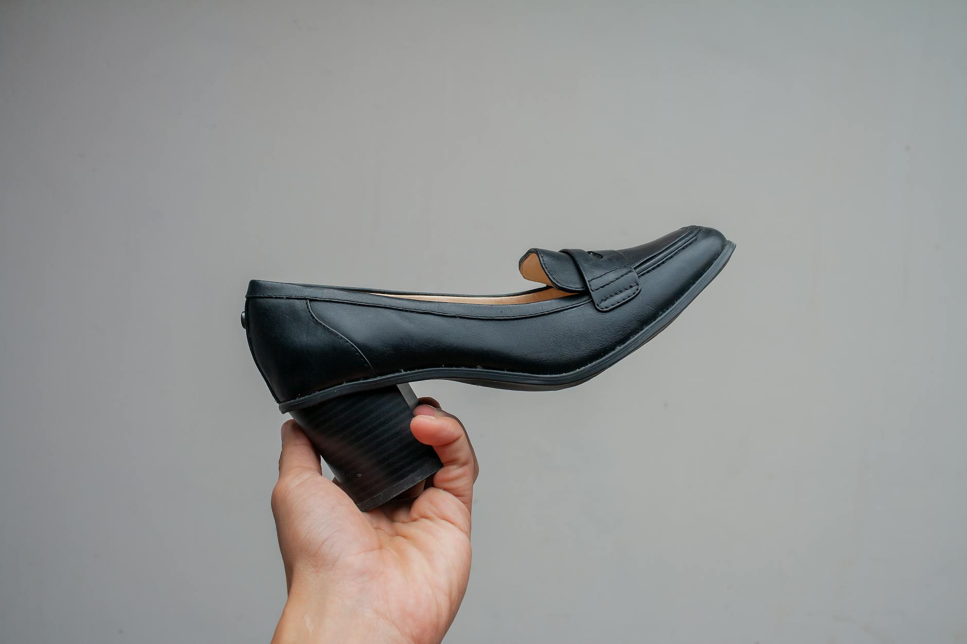 Professional woman's feet in elegant ballet flats in a modern office setting