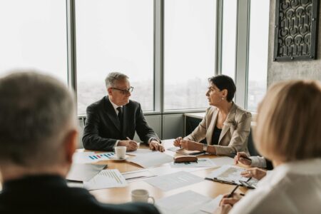Corporate executives in professional meeting discussing business strategy