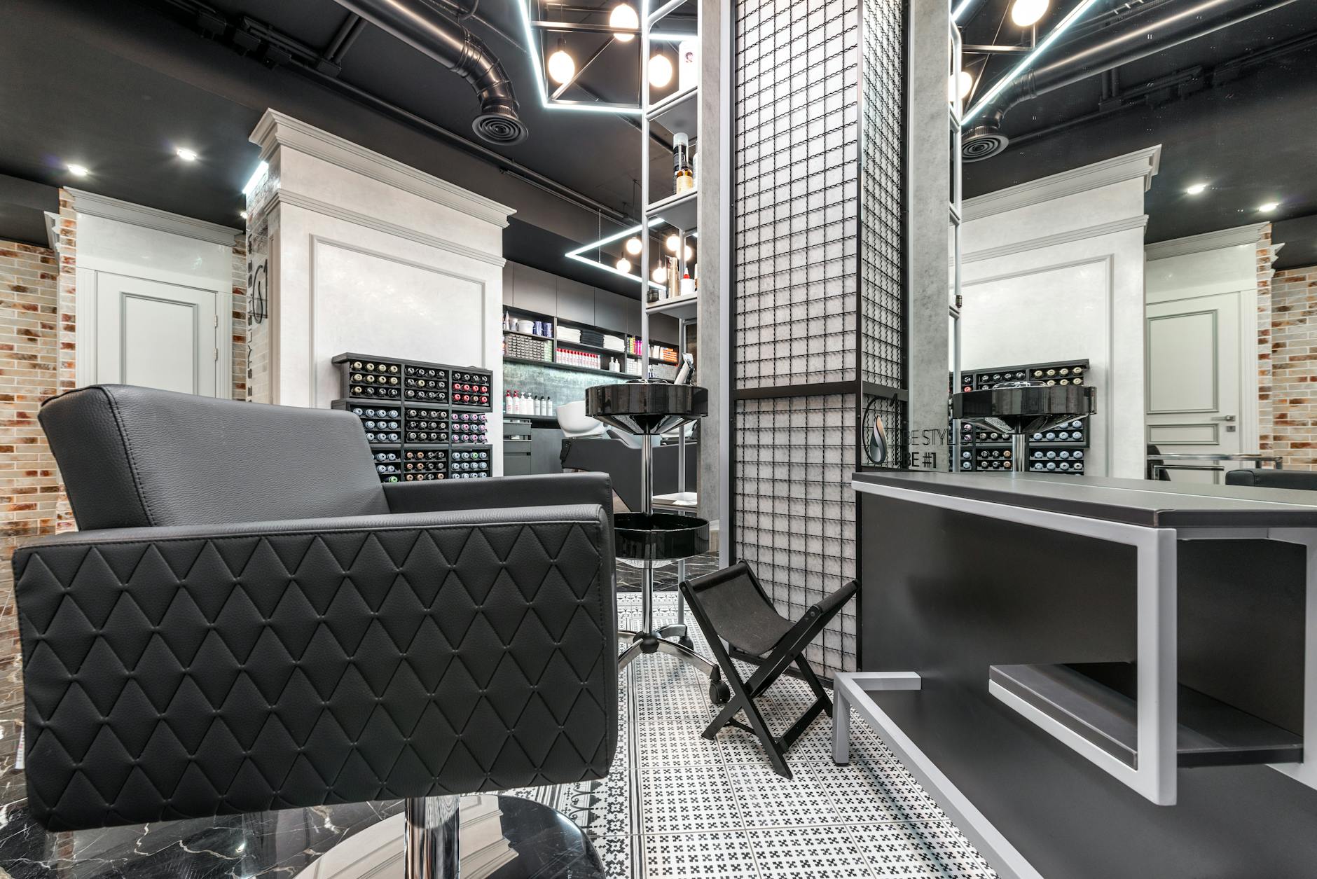 Interior view of traditional barbershop with vintage chairs and mirrors