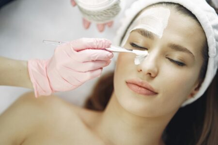 Professional skincare treatment being performed in modern spa setting