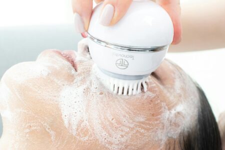 Modern LED light therapy device on clean white surface