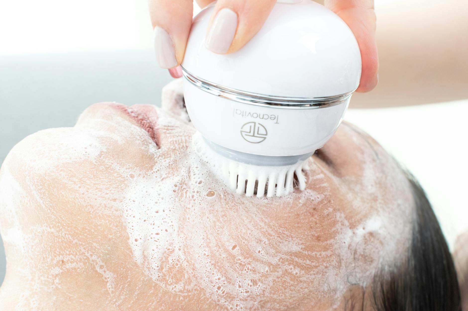 Modern LED light therapy device on clean white surface