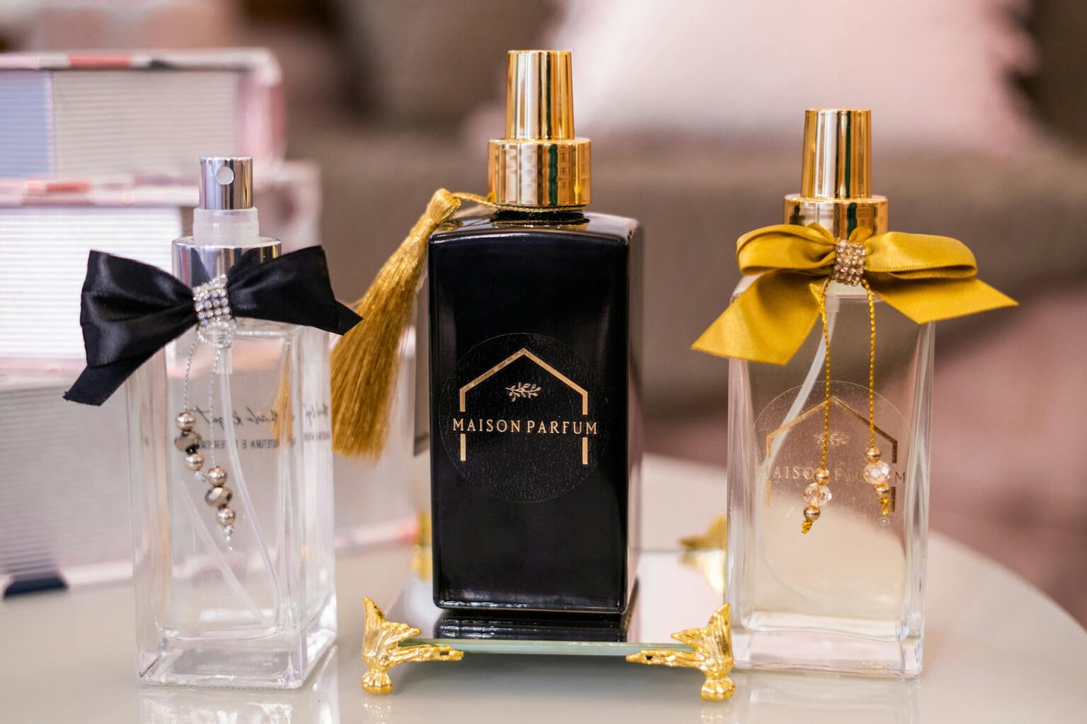 Elegant perfume bottles arranged on marble surface representing luxury fragrance consultation services