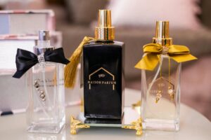 Elegant perfume bottles arranged on marble surface representing luxury fragrance consultation services