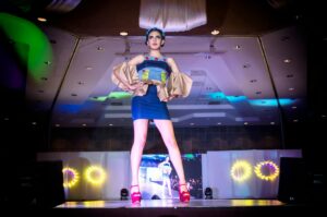 Models walking on fashion runway showcasing contemporary clothing designs