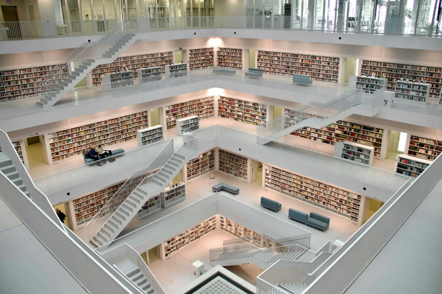 Modern public library interior with bookshelves and reading areas
