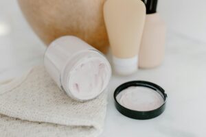 Professional skincare products arranged on a clean white surface for beauty treatment preparation