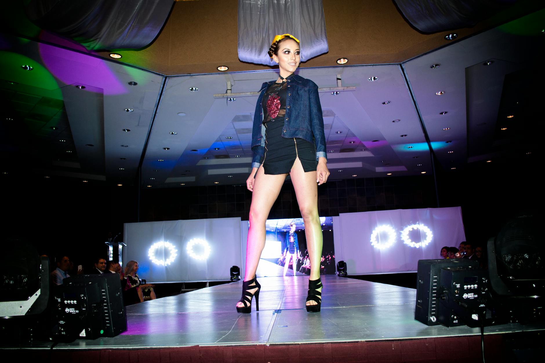 Models walking on fashion runway at designer presentation