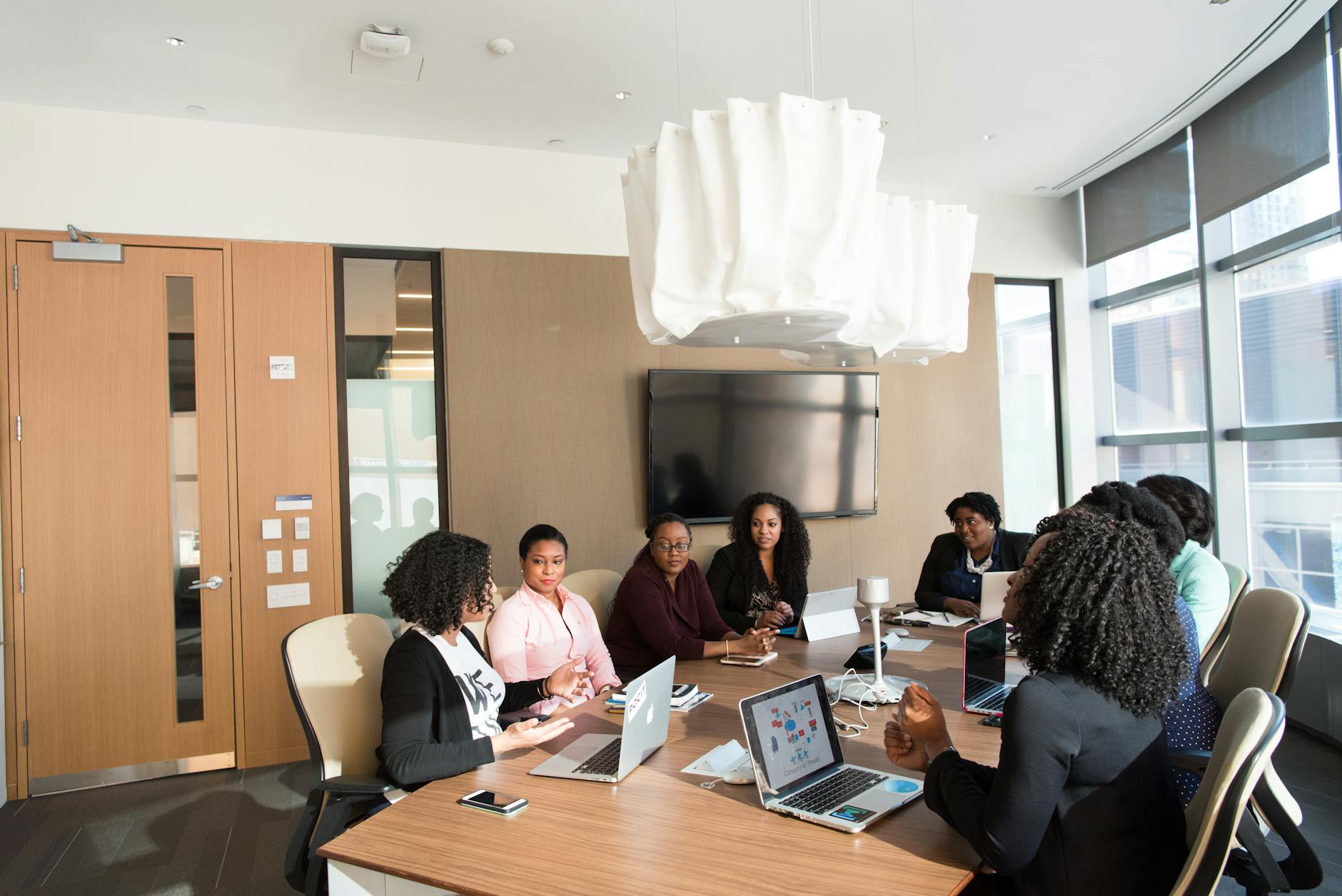 Corporate boardroom with conference table and professional lighting setup