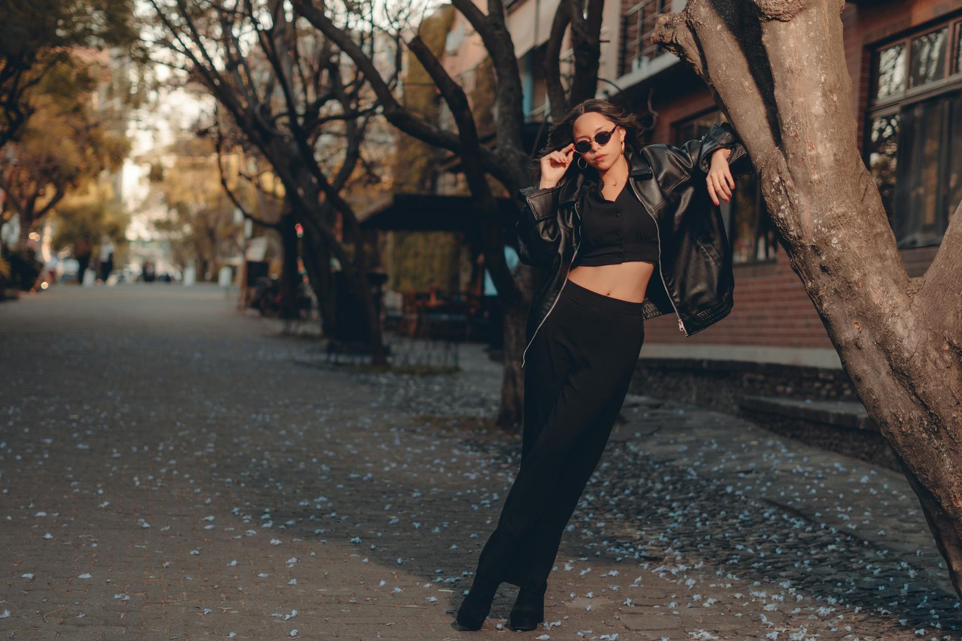 Person wearing casual street style outfit with comfortable sneakers walking on urban sidewalk