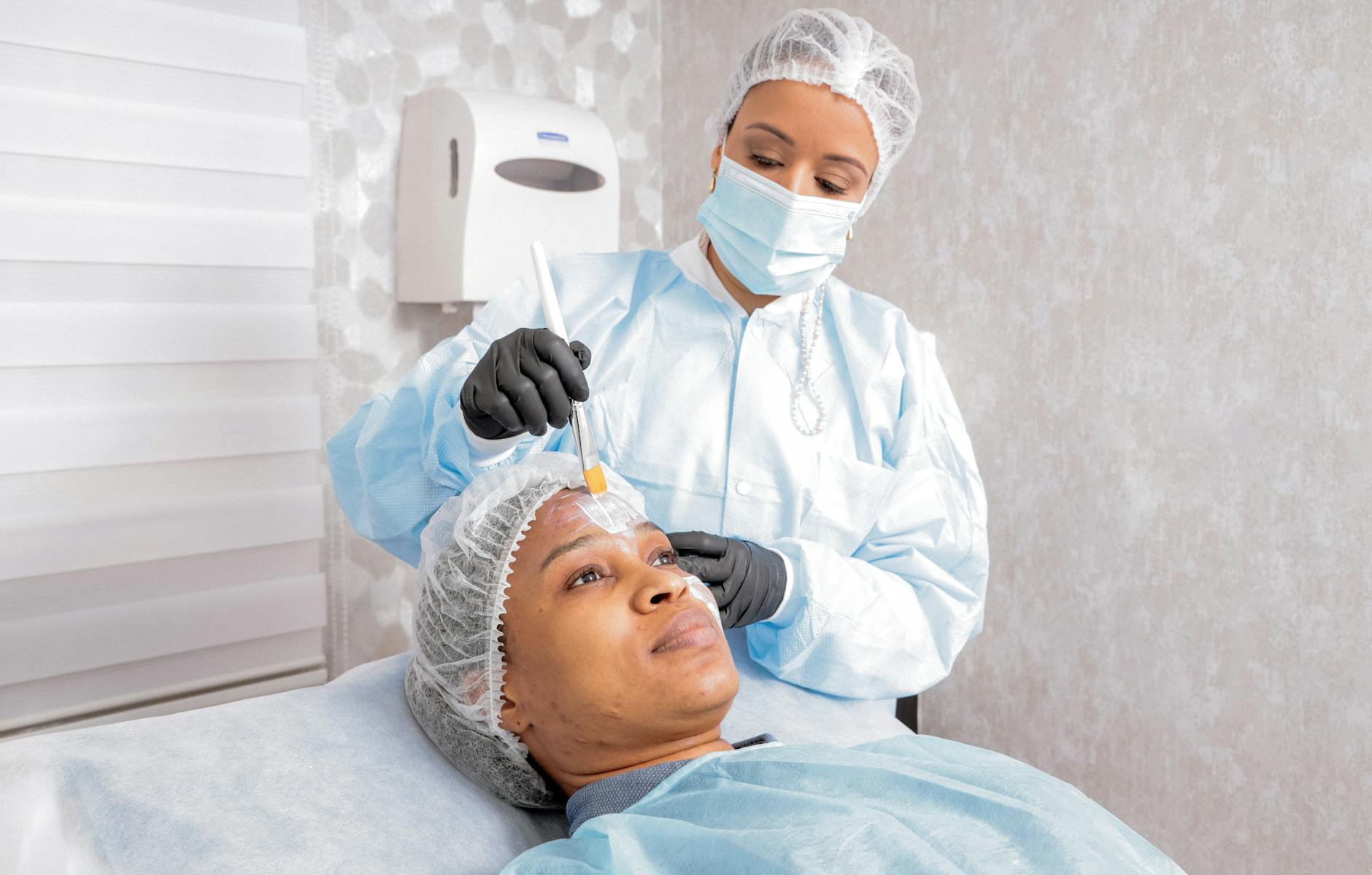 Professional dermatology treatment room with LED light therapy equipment