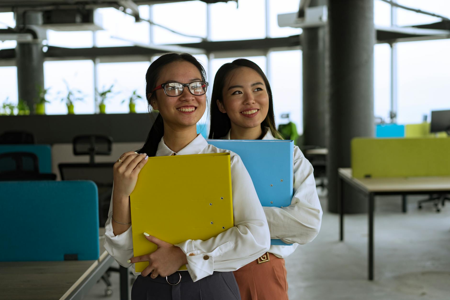 Professional office workers wearing suits in corporate environment