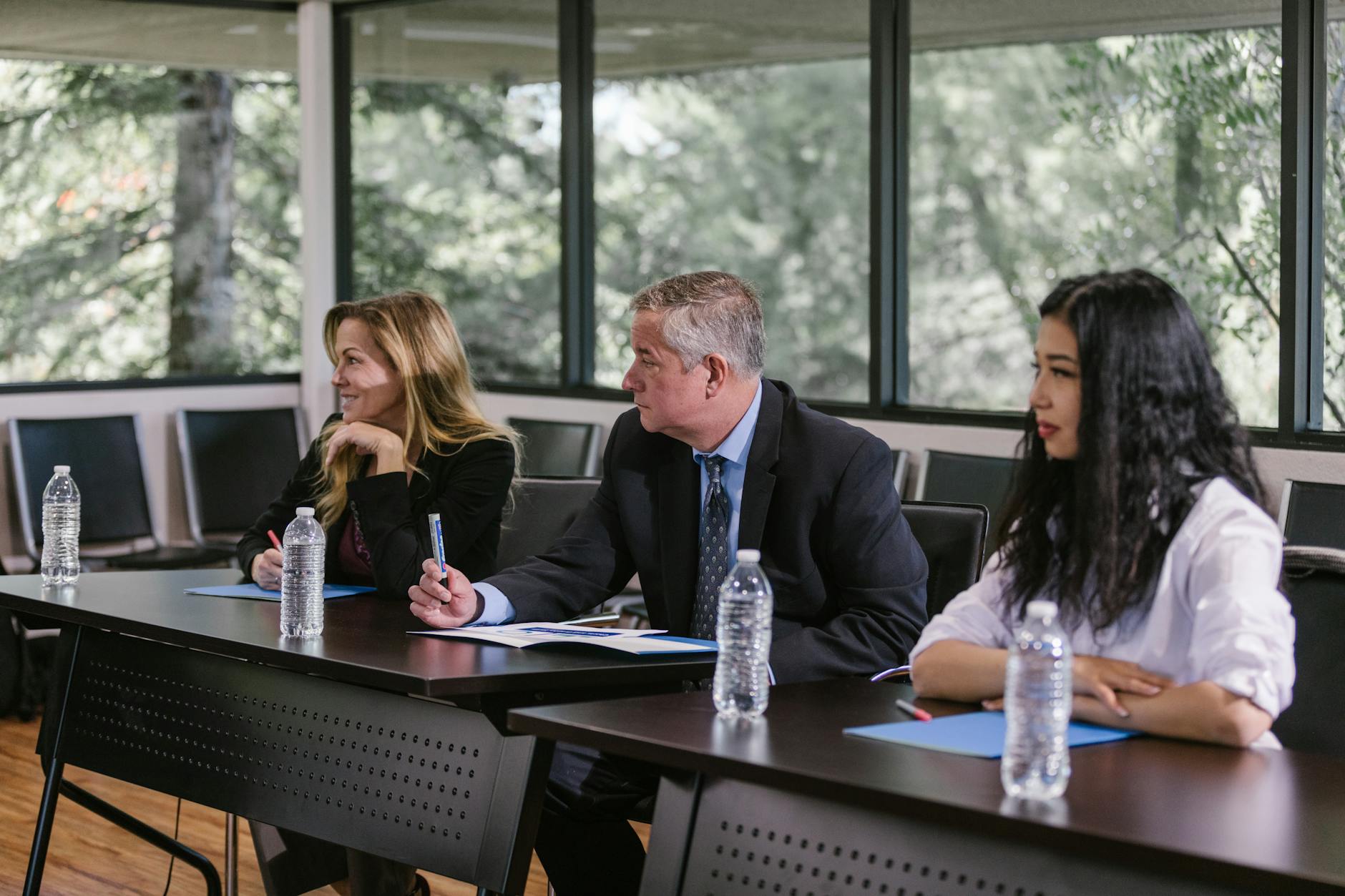 Business professionals in corporate meeting room setting