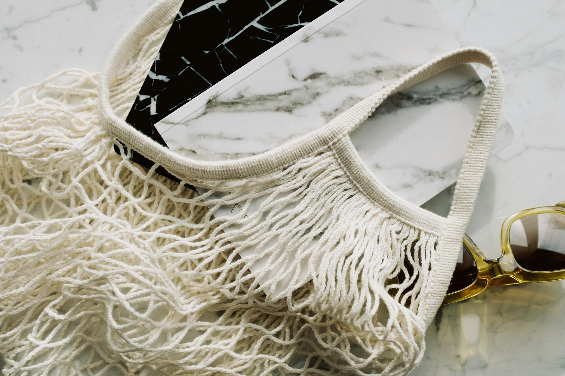 Designer examining eco-friendly fabric materials in natural lighting