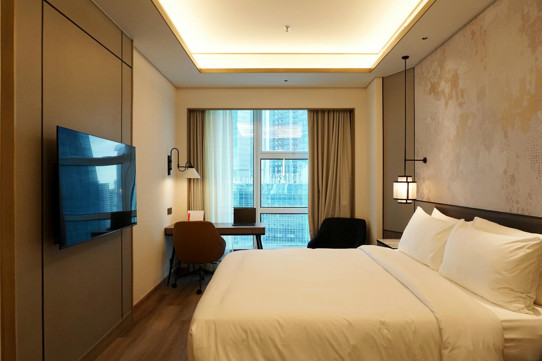 Luxurious hotel bedroom setting where the slipper inspiration originally emerged