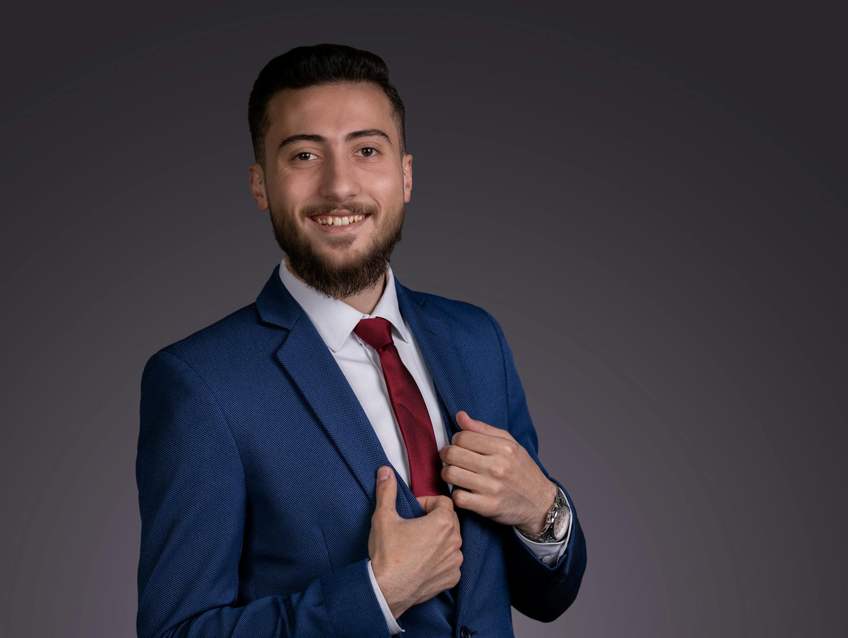 Confident creative director wearing oversized blazer in contemporary workspace environment
