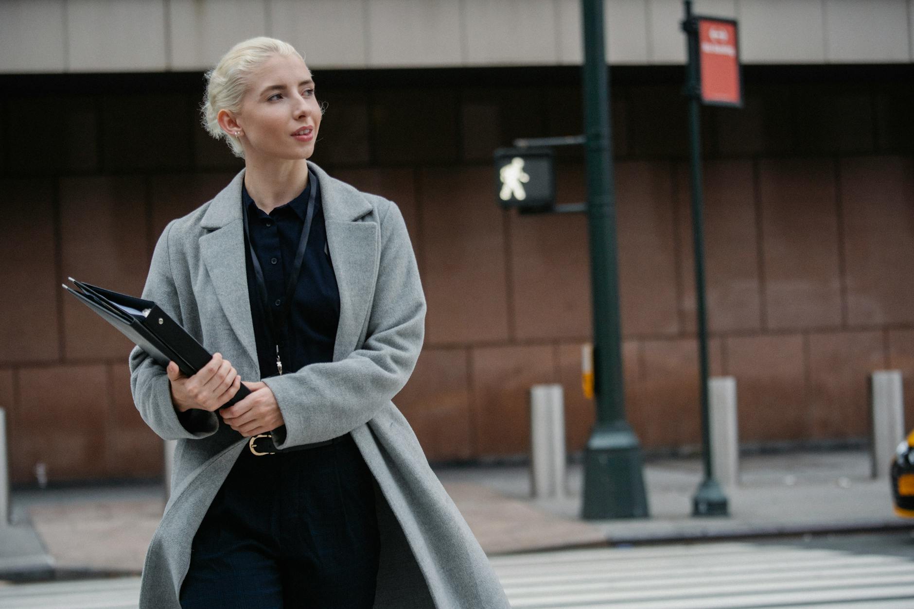 Business professional walking confidently through urban environment