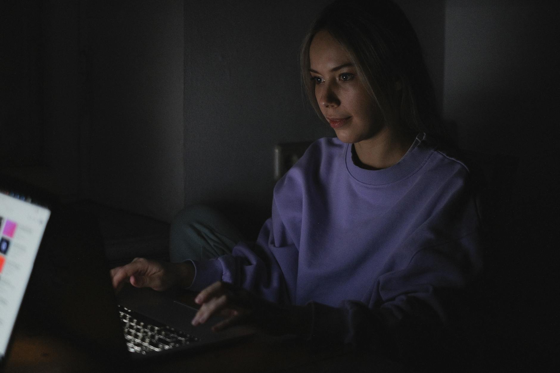 Professional woman working on laptop providing virtual sleep consultation services