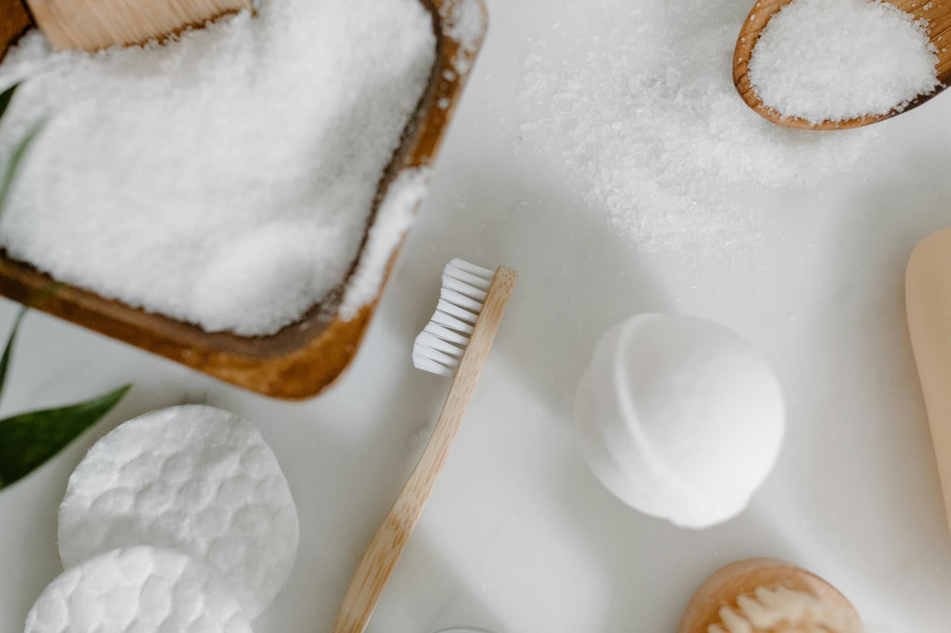 Traditional bamboo massage implements arranged on natural spa setting with towels