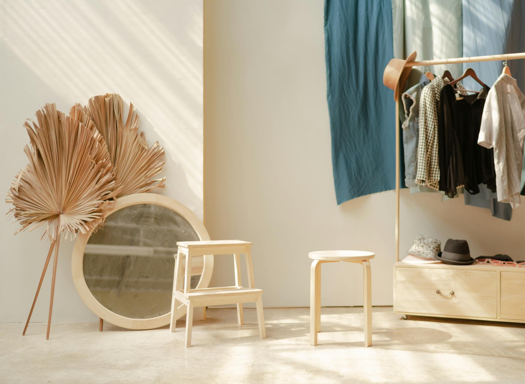Clean, minimalist wardrobe with neatly arranged clothing and accessories