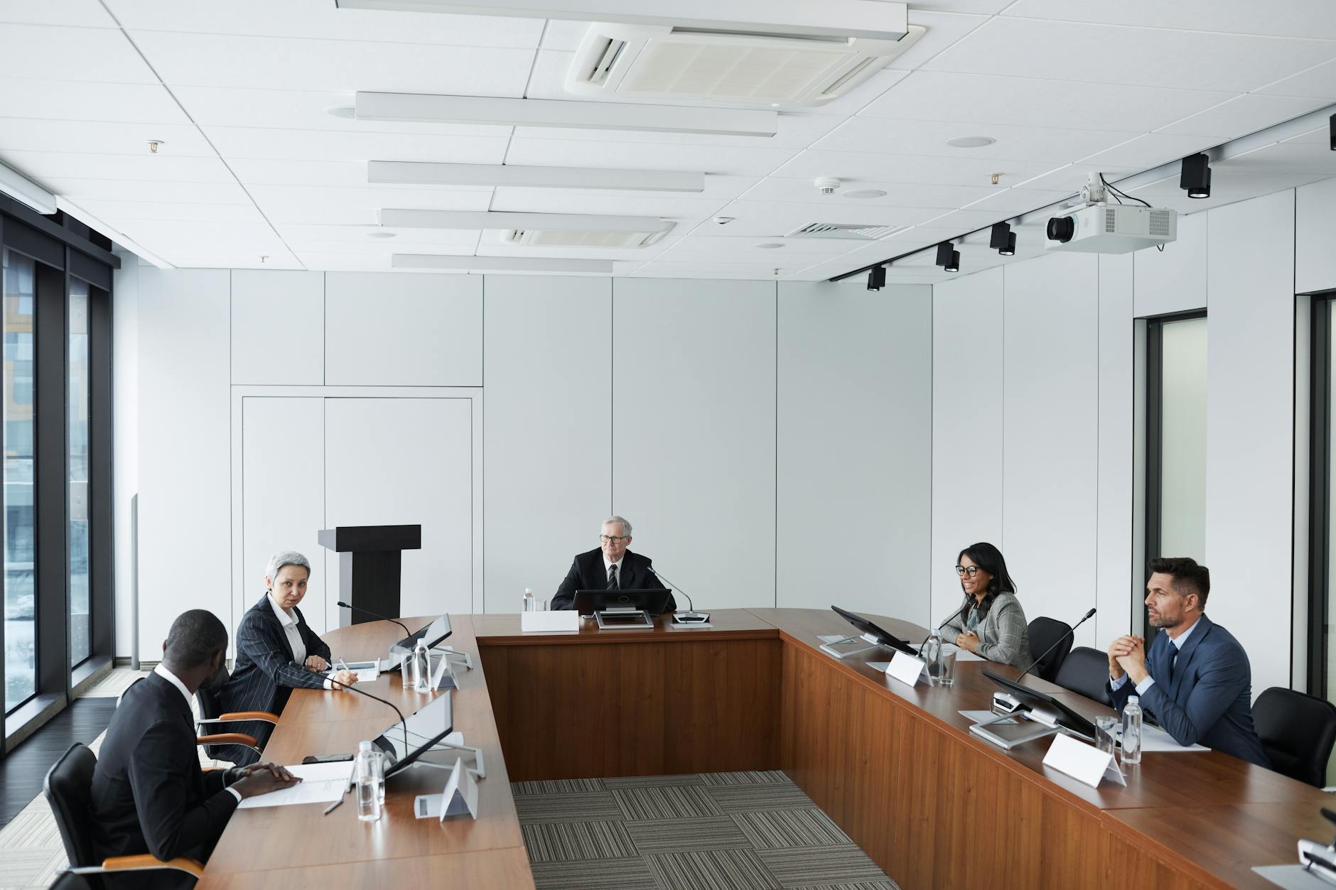 Small group of professionals having an informal discussion in modern wellness space