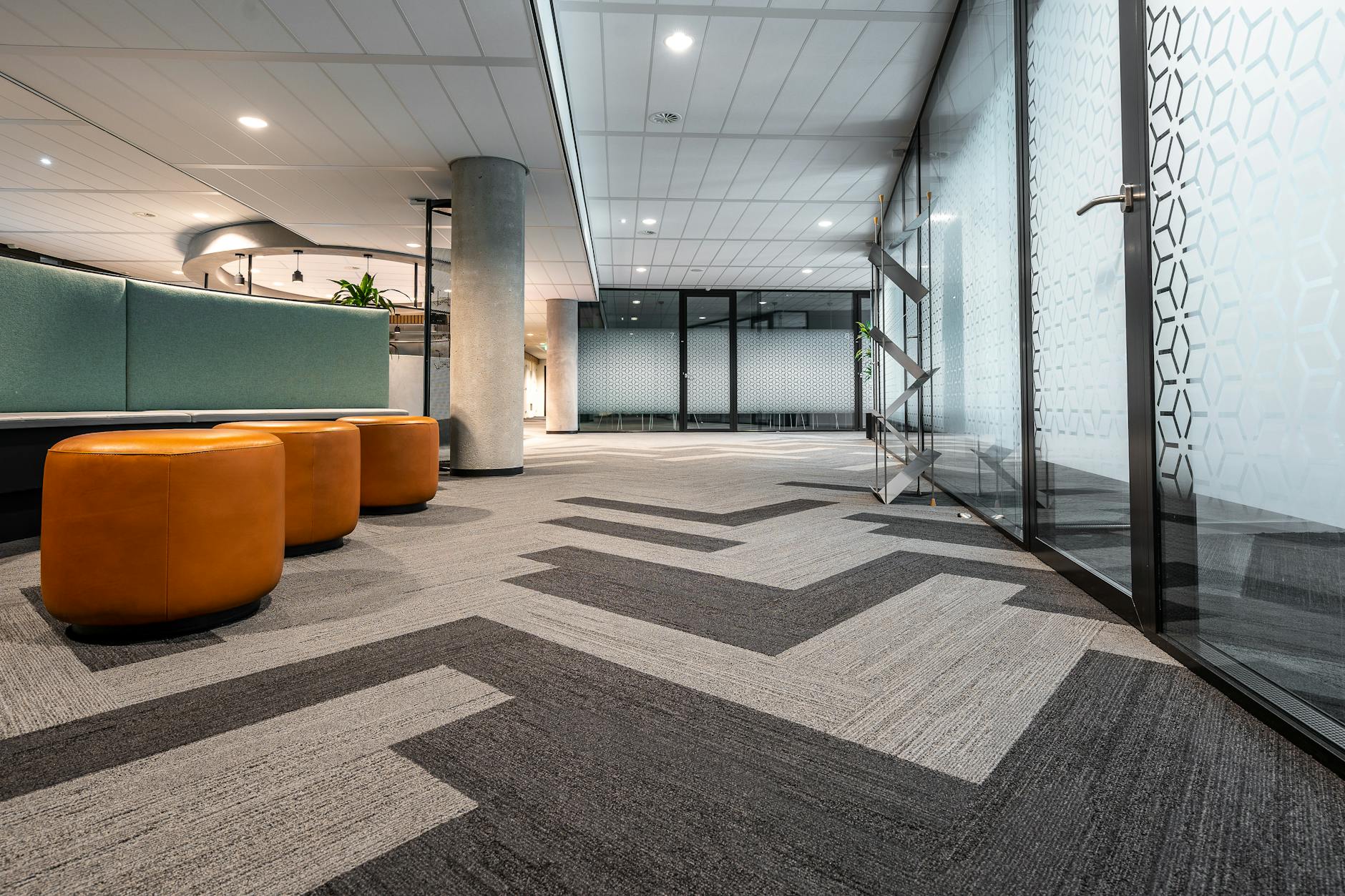 Modern corporate office space with professional workers in business casual attire