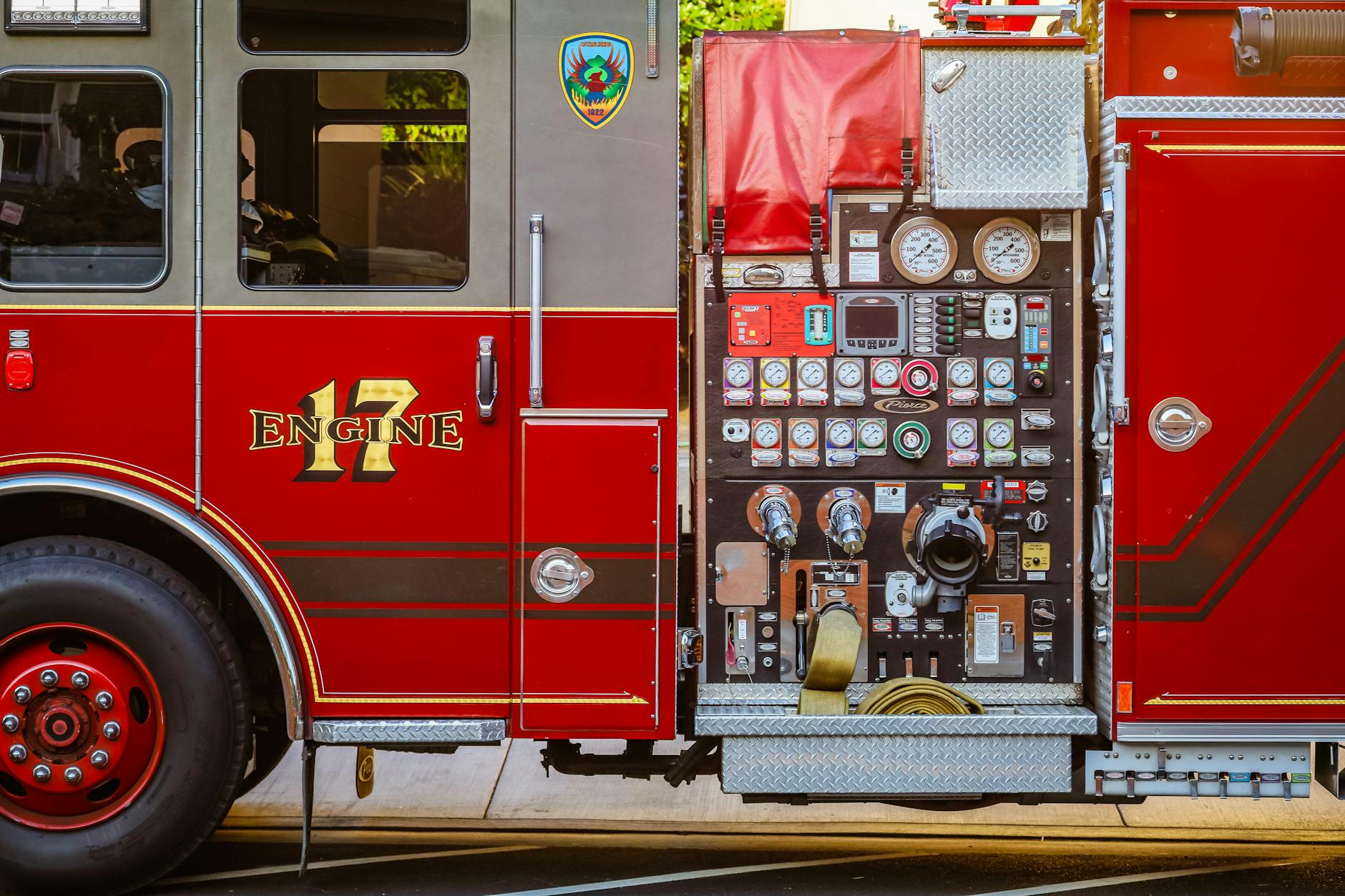 Red fire emergency vehicle parked in station bay