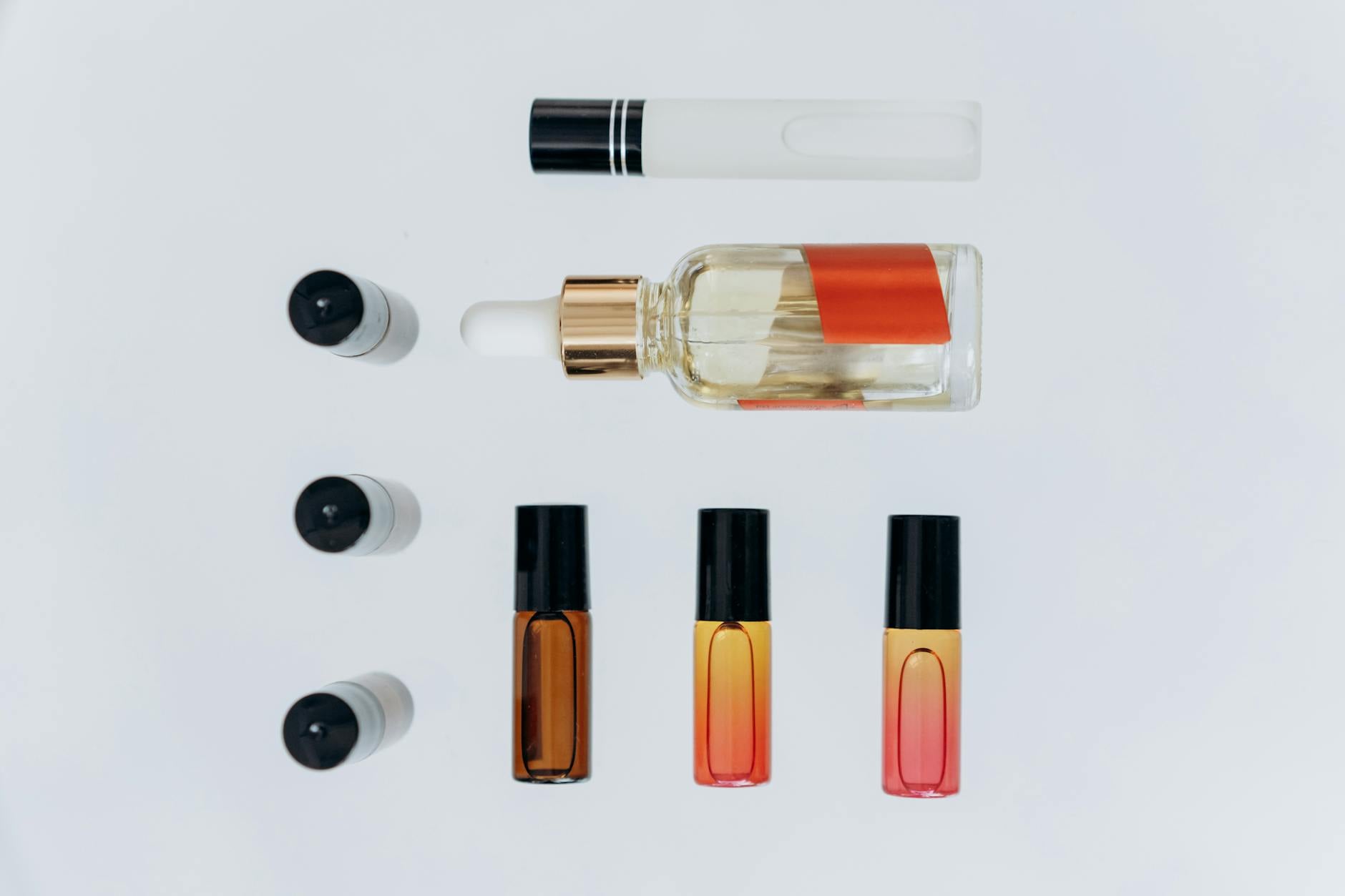 Flat lay arrangement of skincare toner products on a light background