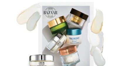 Luxury moisturizer bottles arranged on marble surface