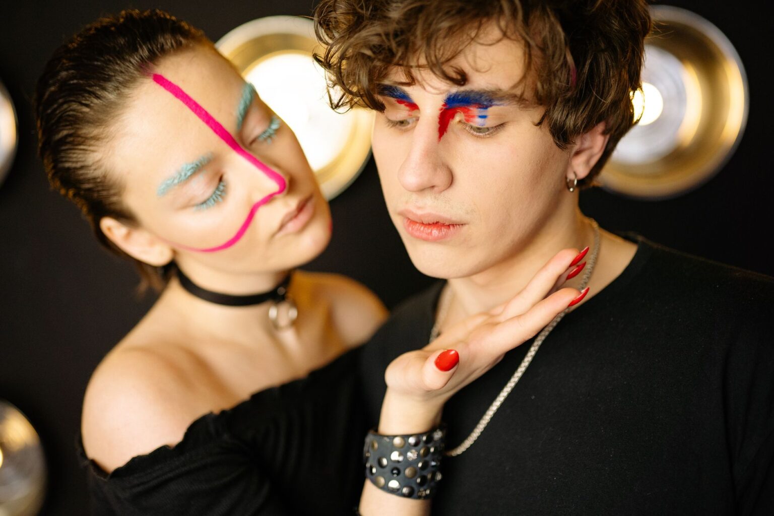 Close-up of bold stage makeup on a young woman performer under bright lights