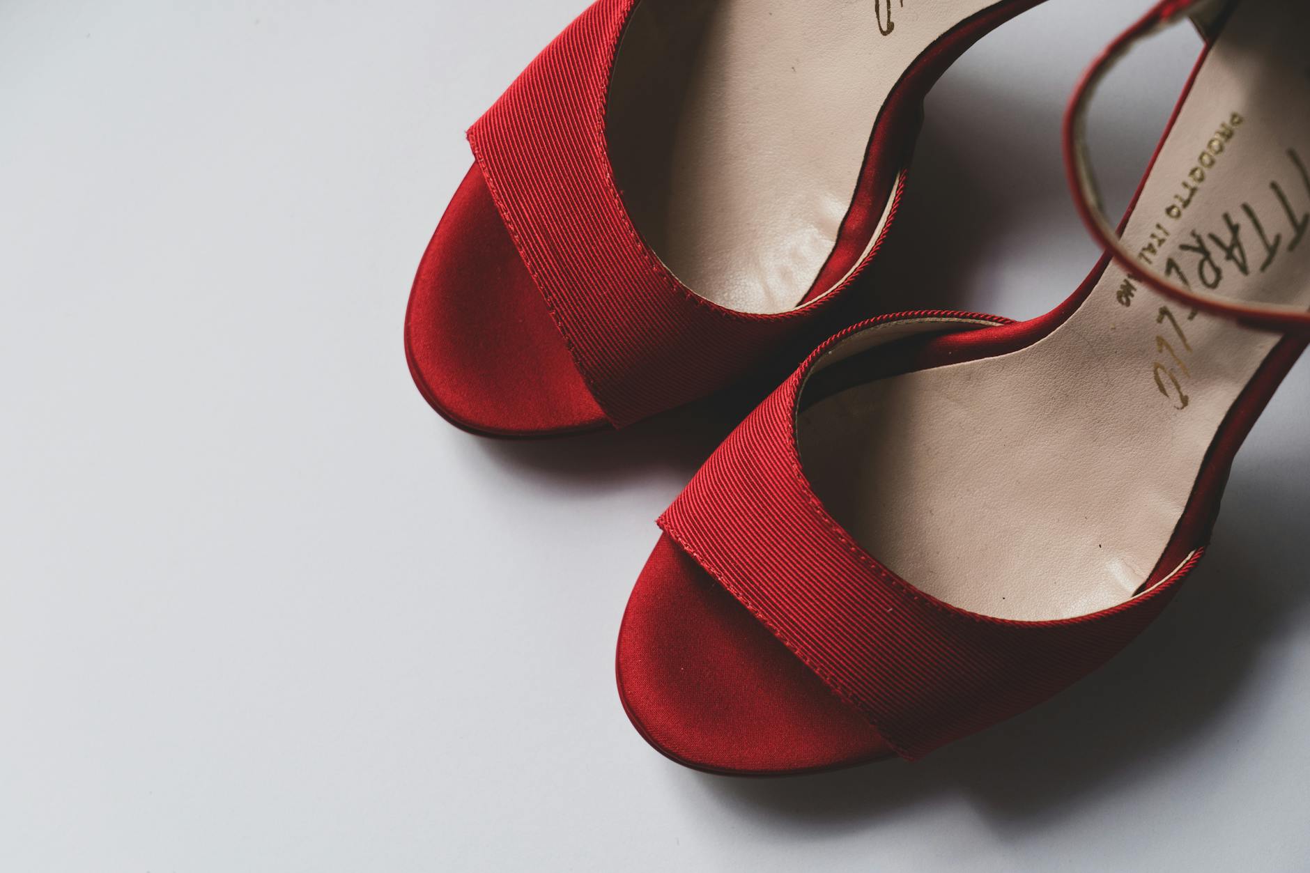 Close-up of elegant women's footwear on a minimal studio surface