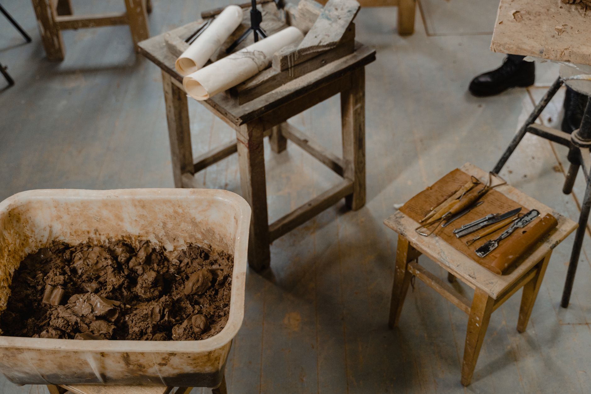 Artisan working at a traditional English pottery wheel in a heritage workshop