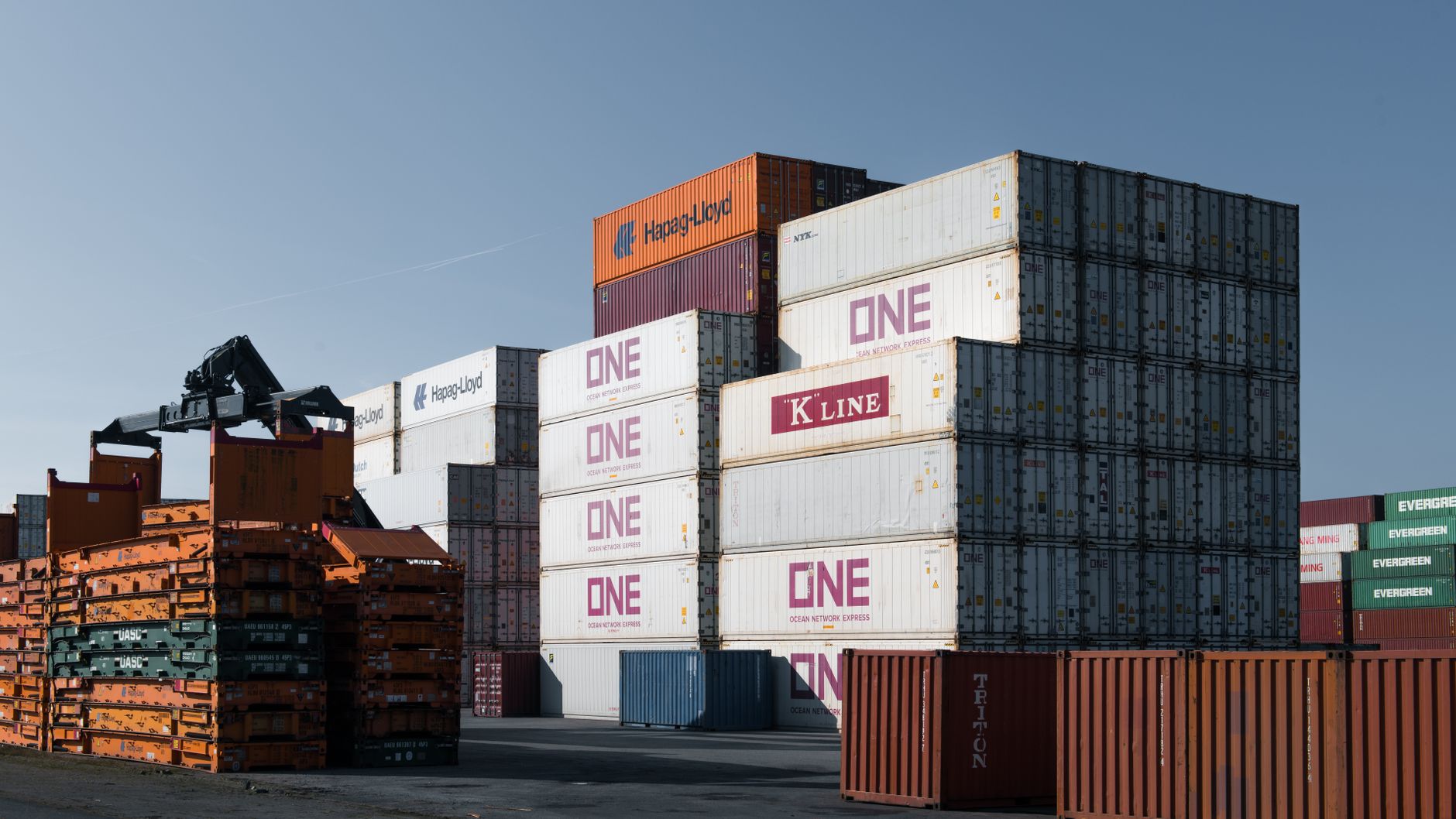 Stacked shipping containers at an industrial freight port