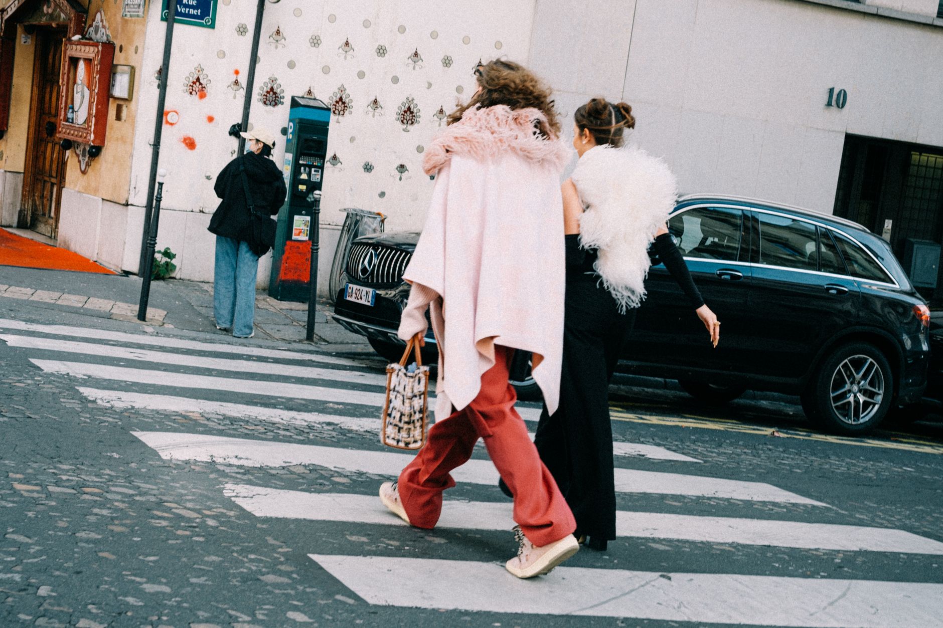 Street-level view of Paris during fashion season with pedestrians