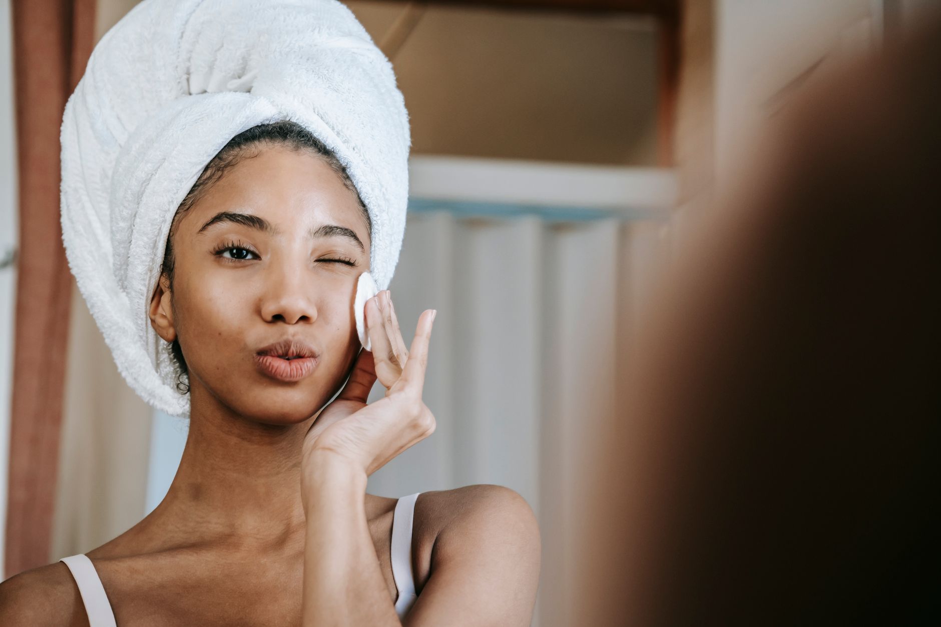 Woman with clear glowing skin in natural daylight