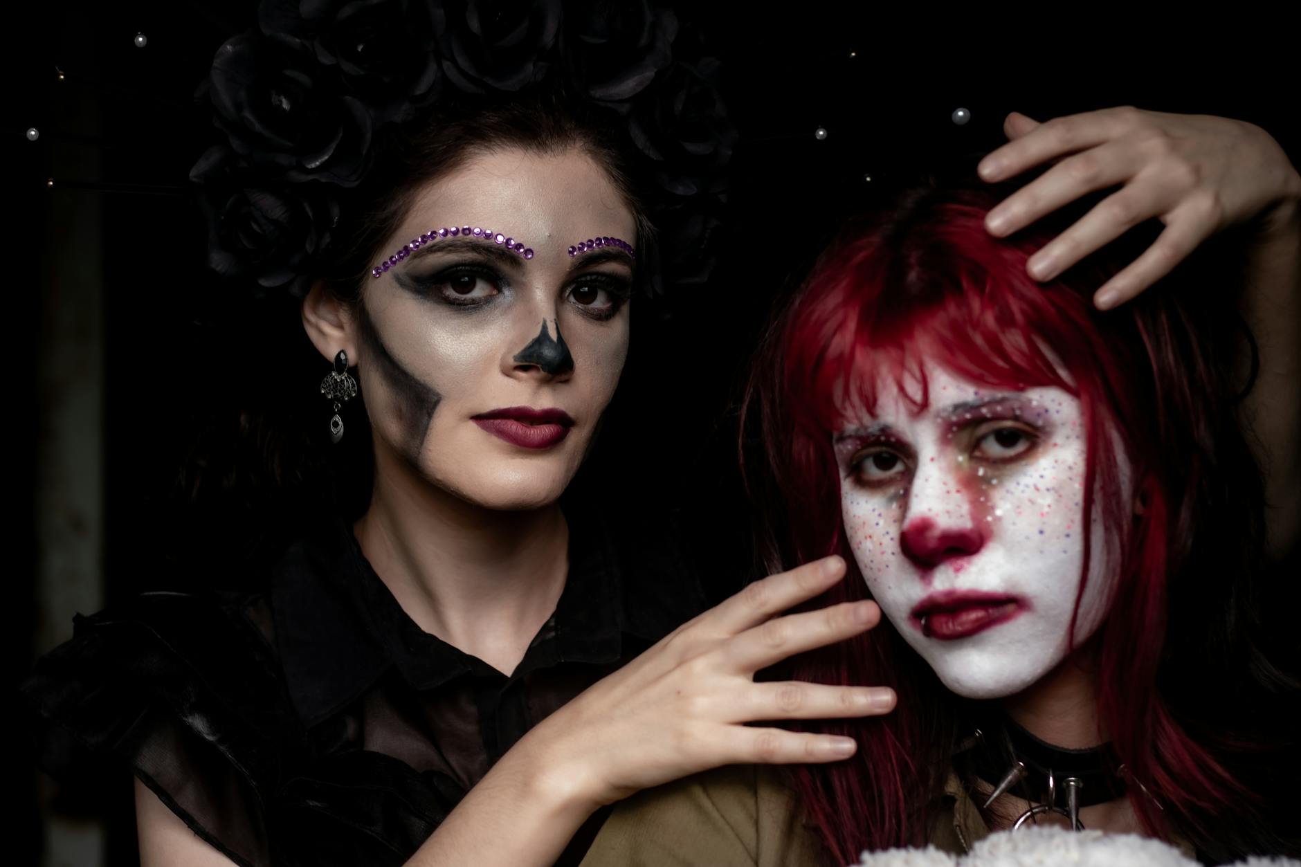 Artistic face with jewel embellishments and dramatic eye makeup referencing high-concept beauty direction