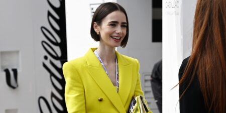 Model wearing a structured chartreuse blazer in an outdoor setting