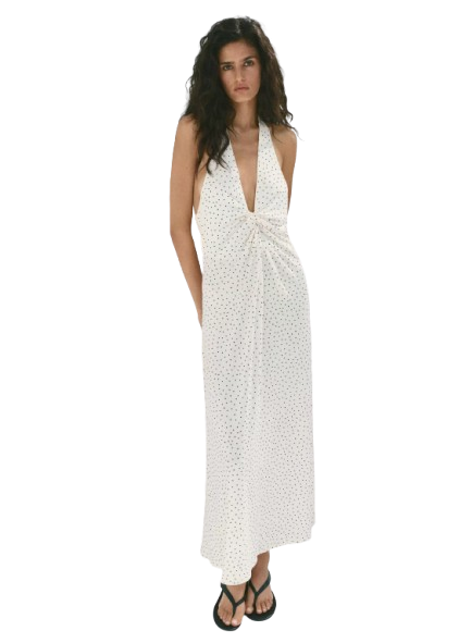 Person wearing a flowy midi dress at an outdoor summer event