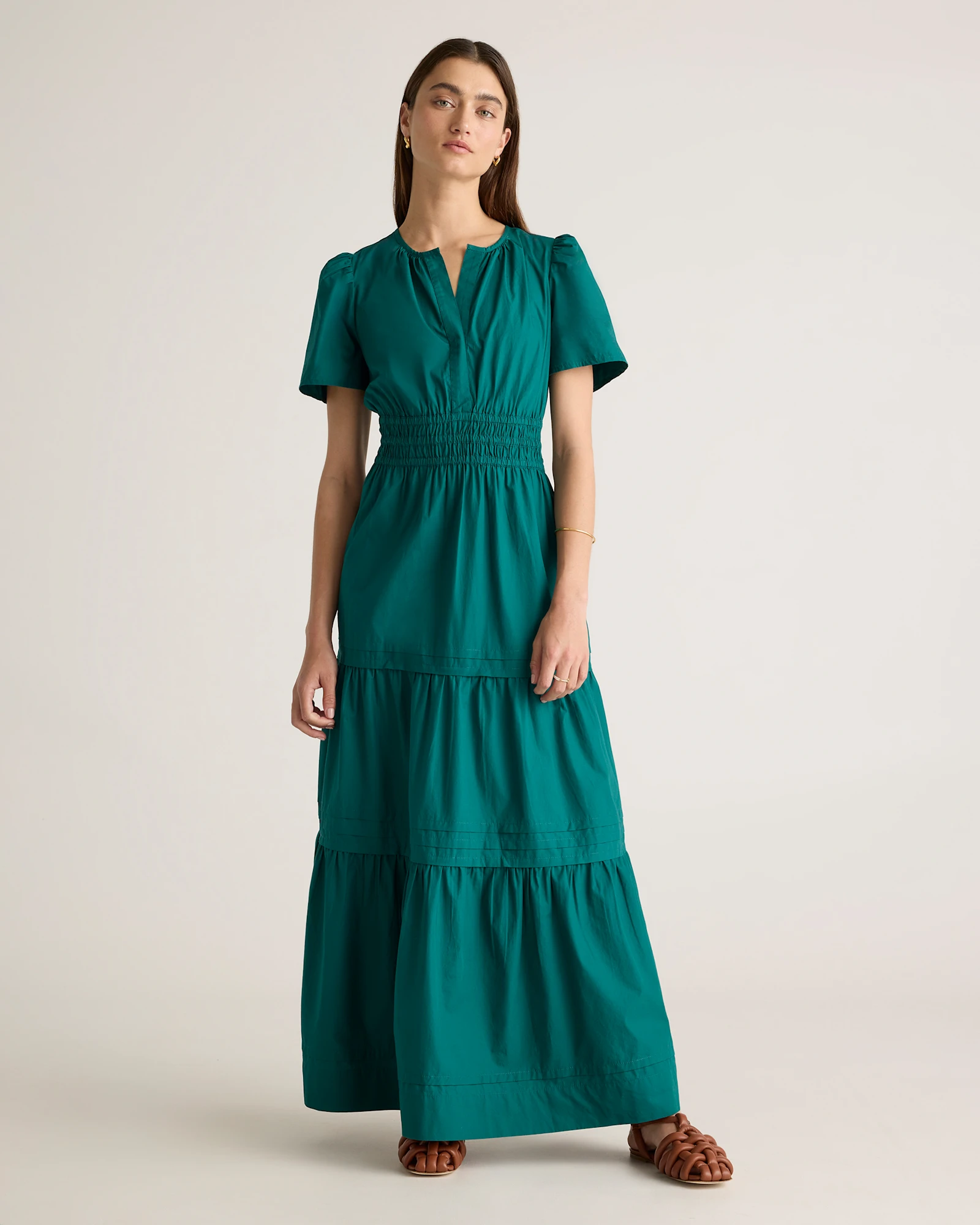 Woman in a loose linen maxi dress in warm weather