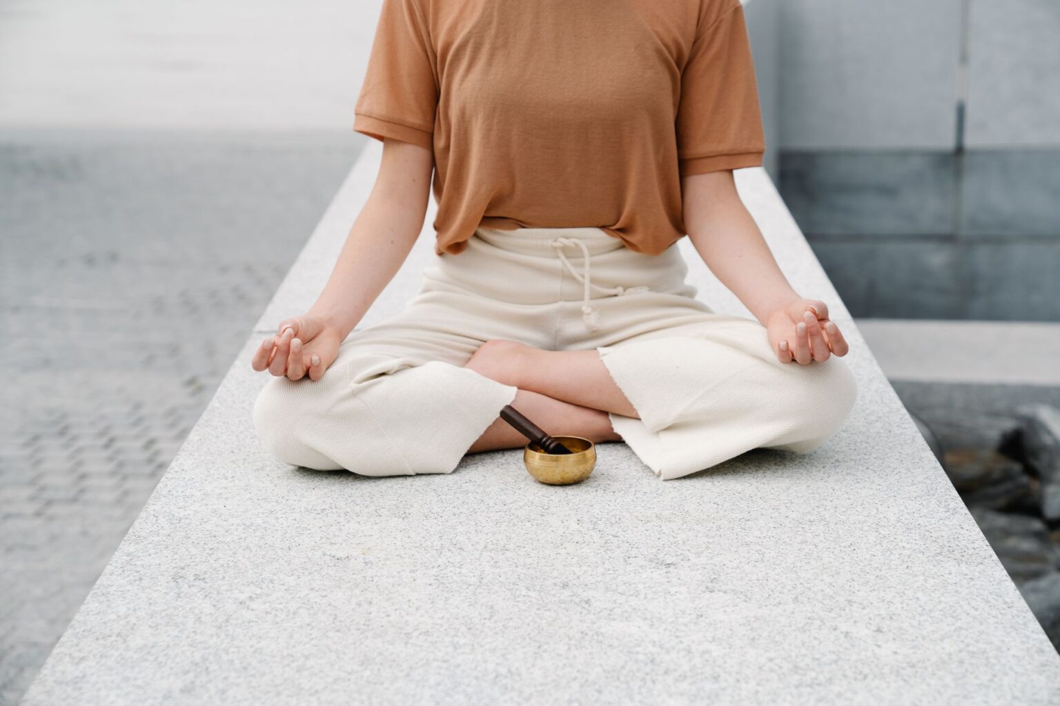 A person practicing mindfulness meditation in a calm, softly lit environment