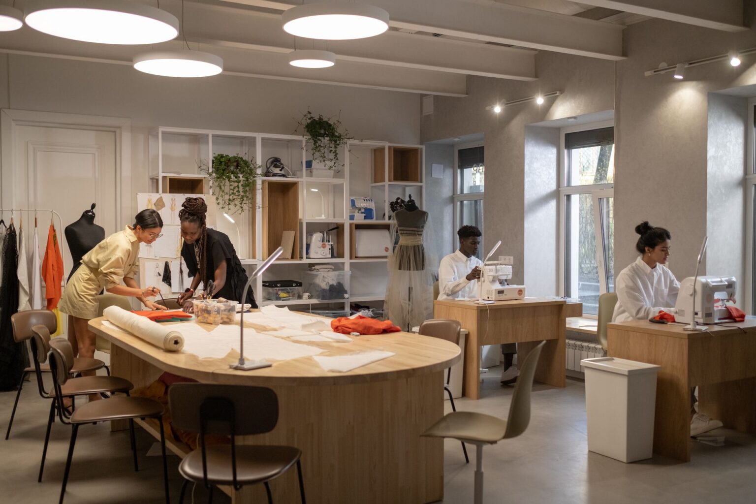 Interior of a high-end fashion atelier with fabric materials and workbenches