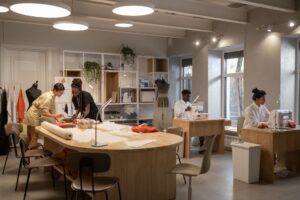 Interior of a high-end fashion atelier with fabric materials and workbenches