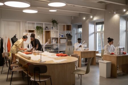 Interior of a high-end fashion atelier with fabric materials and workbenches