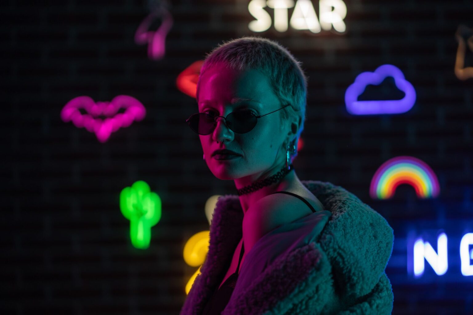 A pop artist in minimalist fashion styling backstage at a music event